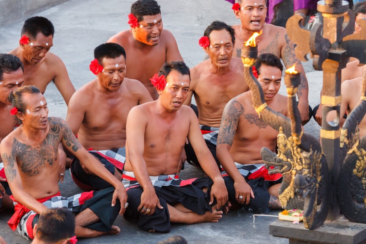 Hindus chanting sacred mantras at the Uluwatu temple in Bali, Indonesia