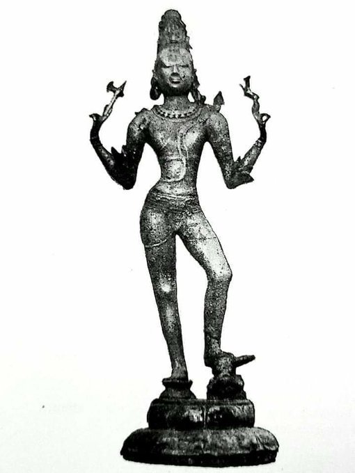 Sri Tripurantaka with his left foot a gana blowing a shankha and his right foot atop a riser. Bronze. Tamil Nadu. 11th century. Size not provided. Vellanur. Note the naga peeping over Lord Siva's left shoulder.
Photo By John Anderson